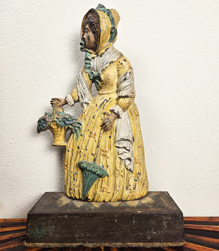 Bradley & Hubbard Woman With Basket 01 Bradley & Hubbard Woman in Yellow Dress Doorstop - Image 1